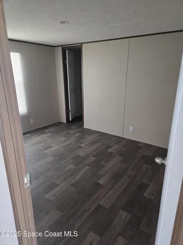 an empty room with a wooden door