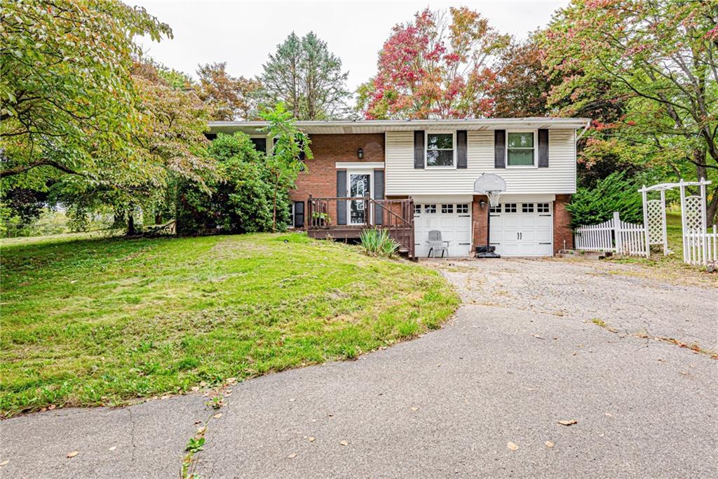 486 Engle Road Industry, PA 15052 - Photo 1 of 38 a front view of a house with garden