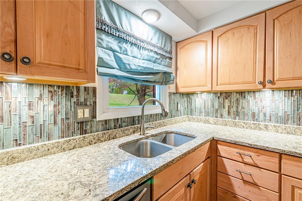 486 Engle Road Industry, PA 15052 - Photo 11 of 38 a kitchen with a sink a counter top space and cabinets