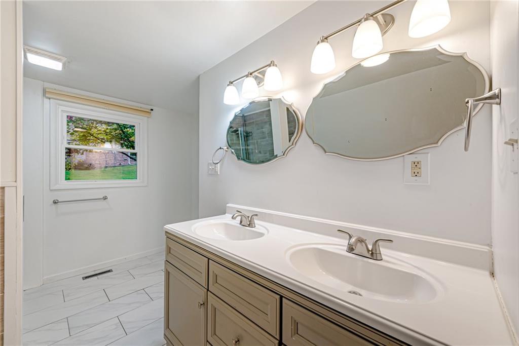 486 Engle Road Industry, PA 15052 - Photo 13 of 38 a bathroom with a sink and a mirror