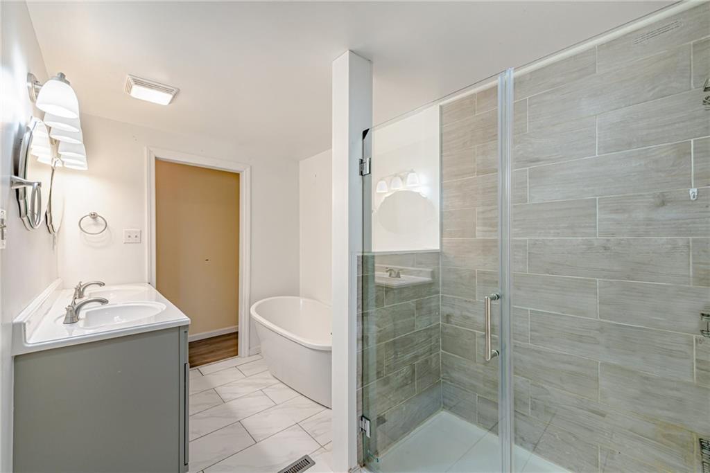 486 Engle Road Industry, PA 15052 - Photo 14 of 38 a bathroom with a sink a toilet and shower