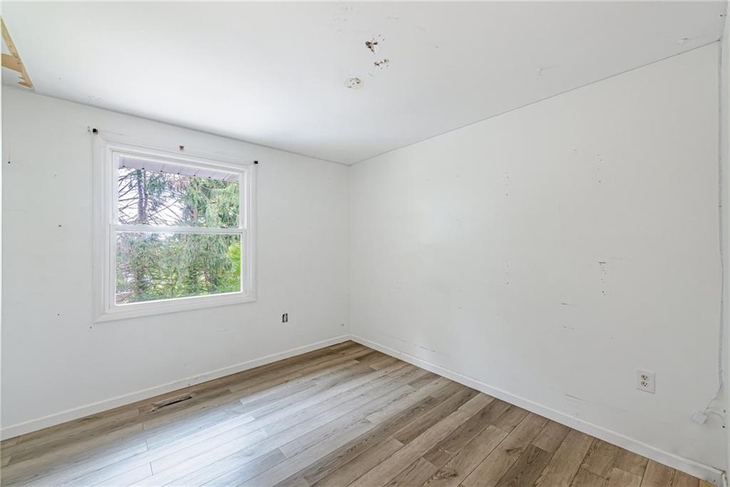 486 Engle Road Industry, PA 15052 - Photo 15 of 38 a view of empty room with wooden floor and fan