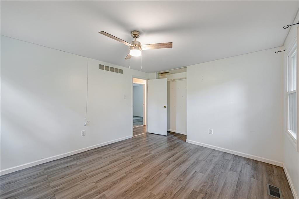 486 Engle Road Industry, PA 15052 - Photo 18 of 38 an empty room with wooden floor and windows