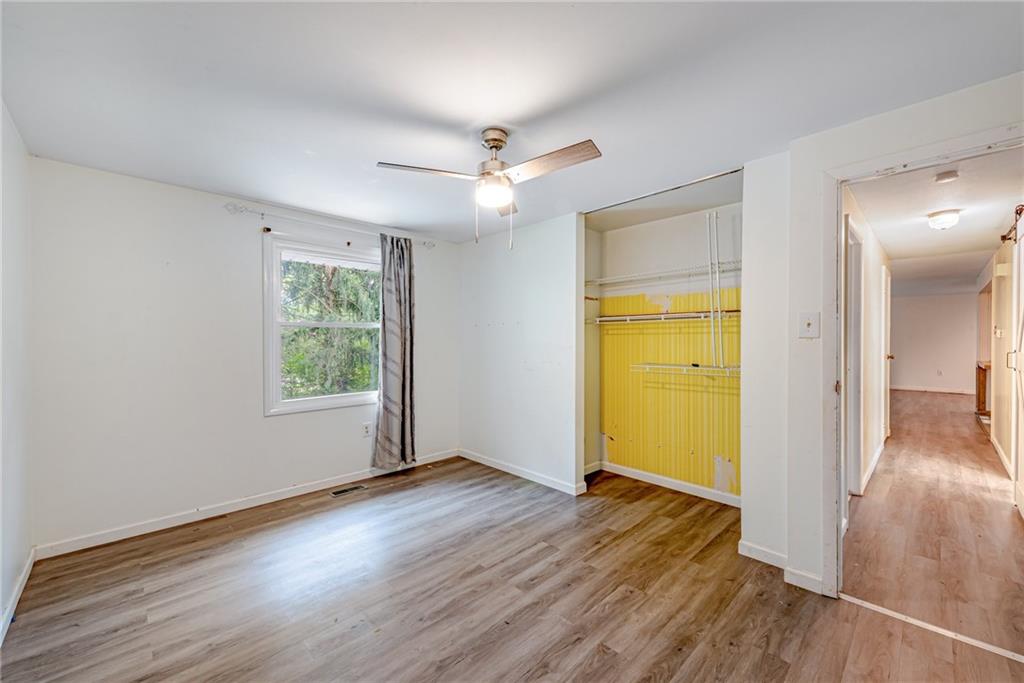 486 Engle Road Industry, PA 15052 - Photo 20 of 38 wooden floor in an empty room with a window