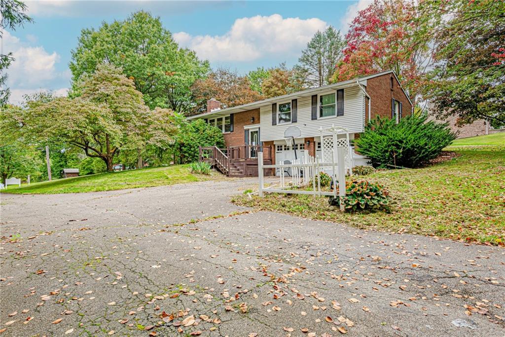 486 Engle Road Industry, PA 15052 - Photo 2 of 38 a view of a house with a yard and pathway