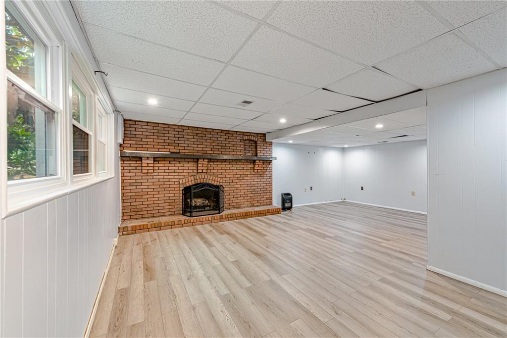 486 Engle Road Industry, PA 15052 - Photo 22 of 38 a view of an empty room with a fireplace and a window