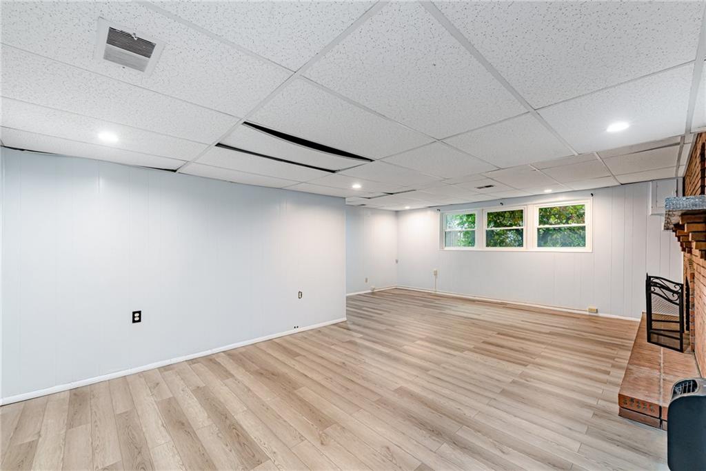 486 Engle Road Industry, PA 15052 - Photo 23 of 38 an empty room with wooden floor and windows