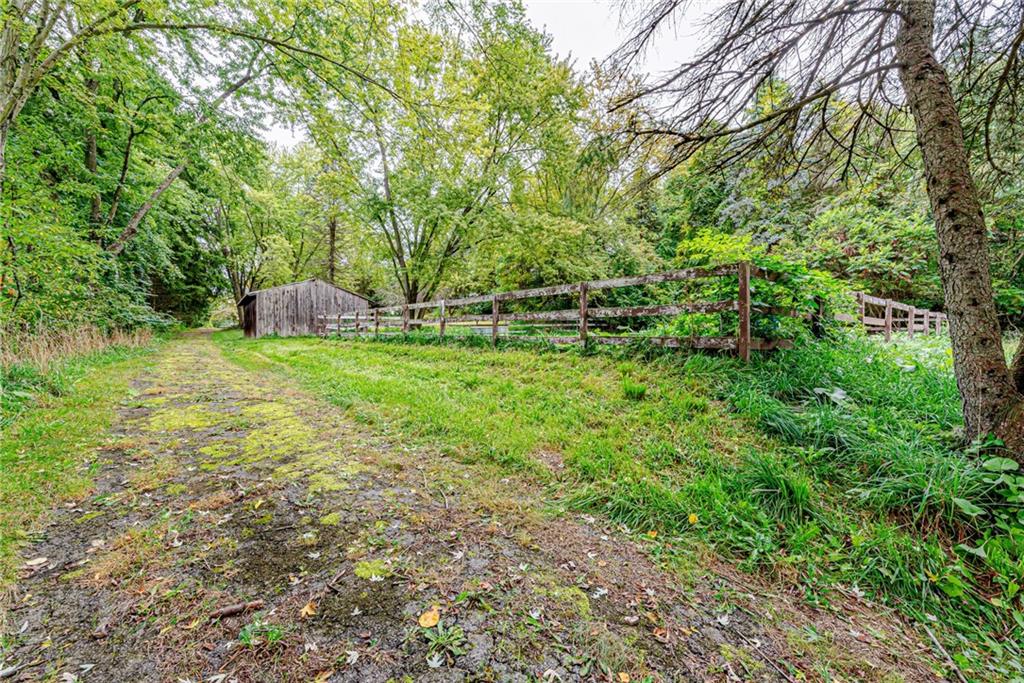 486 Engle Road Industry, PA 15052 - Photo 29 of 38 a backyard of a house with lots of green space and chair