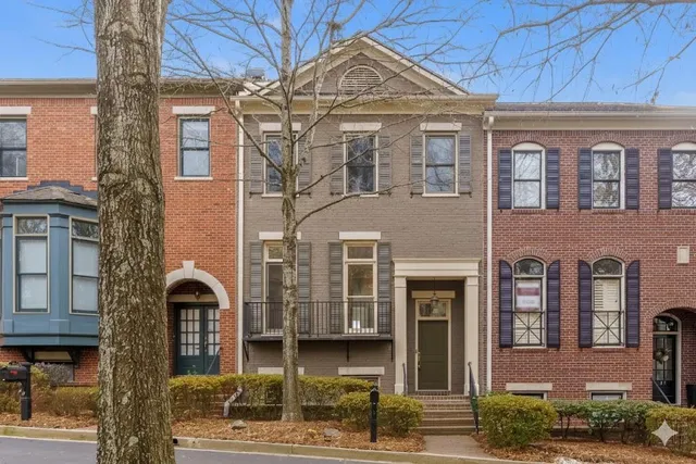 a front view of a building with garden