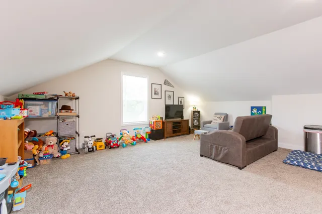 a living room with furniture and toys