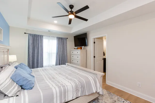 a bedroom with a large bed and a large window