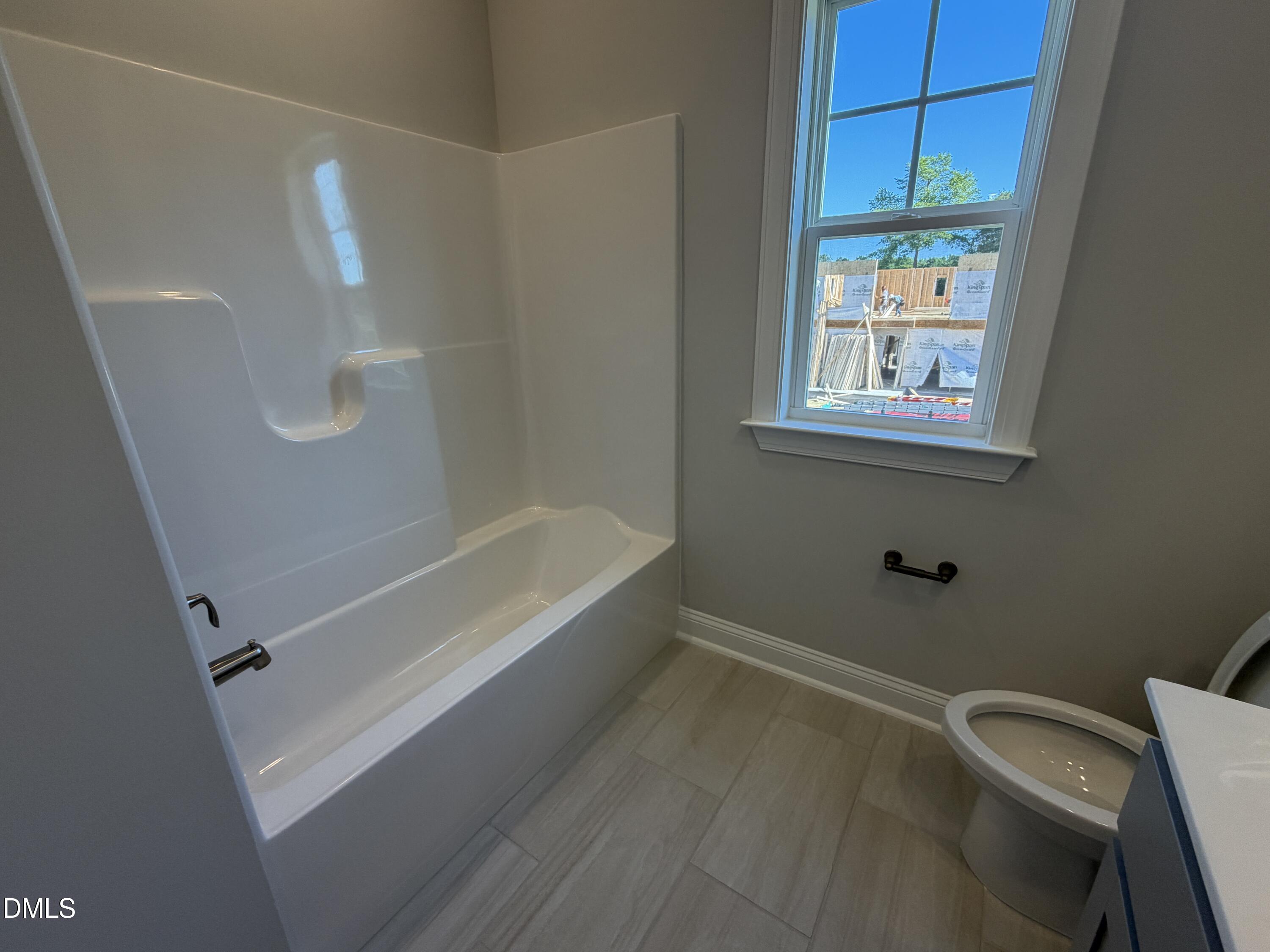 3016 Sandy Bluff Road Raleigh, NC 27616 - Photo 27 of 34 a bathroom with a bathtub and shower