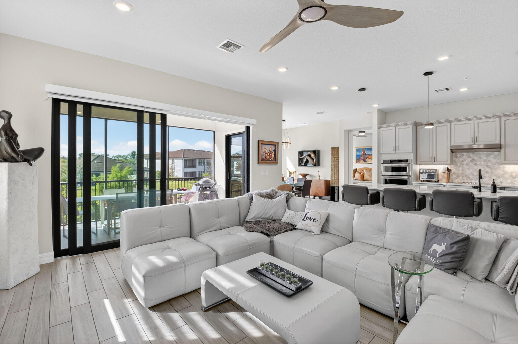 21956 Canadensis Circle, Unit 201 Boca Raton, FL 33428 - Photo 1 of 47 a living room with furniture and a large window