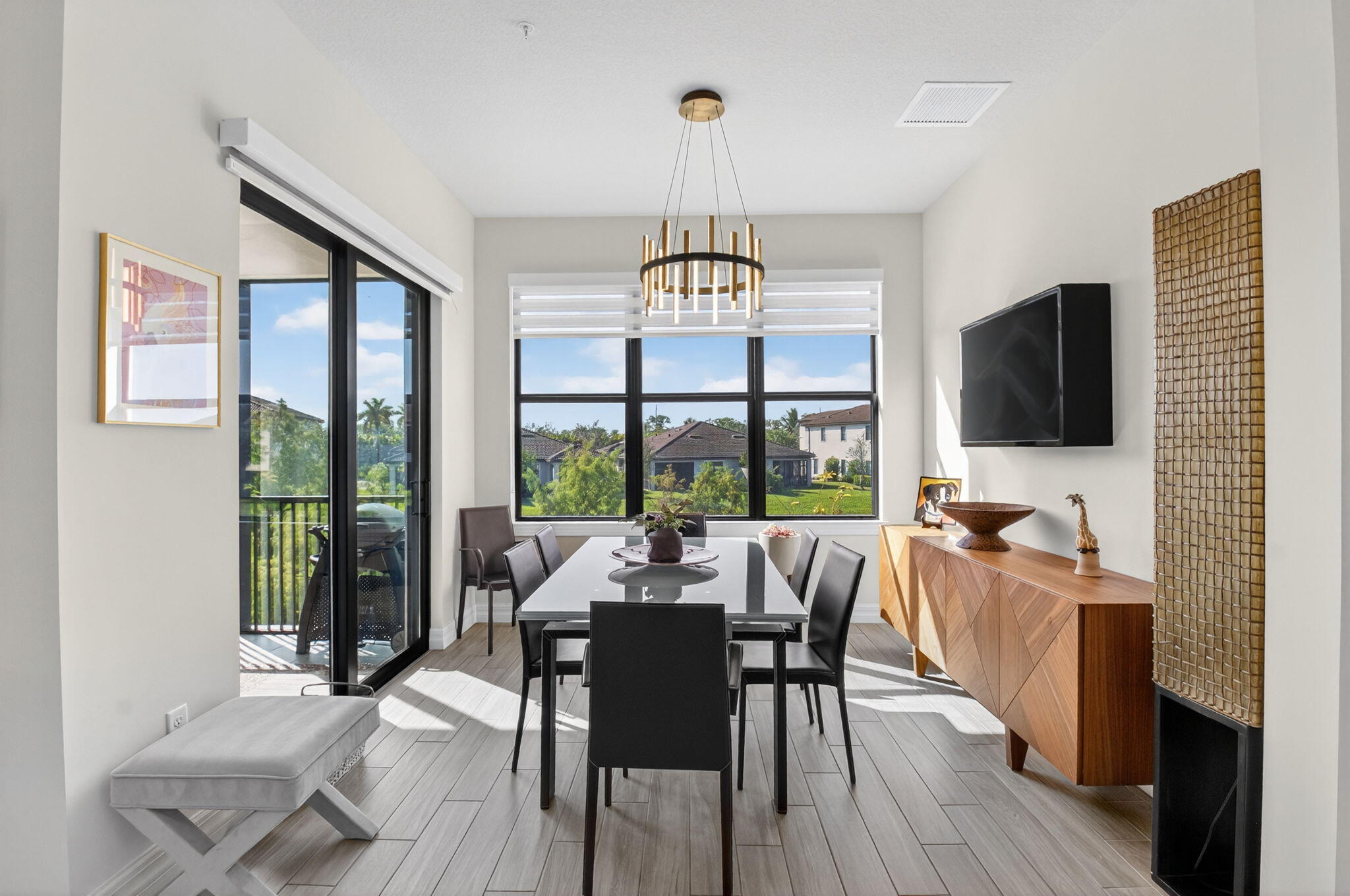 21956 Canadensis Circle, Unit 201 Boca Raton, FL 33428 - Photo 15 of 47 a view of a dining room with furniture window and outside view