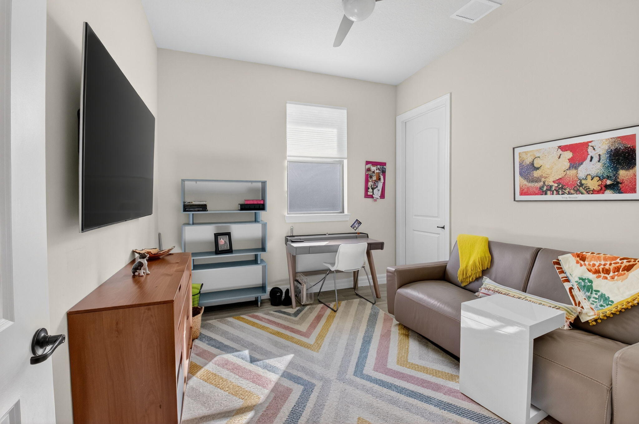 21956 Canadensis Circle, Unit 201 Boca Raton, FL 33428 - Photo 23 of 47 a living room with furniture and a flat screen tv