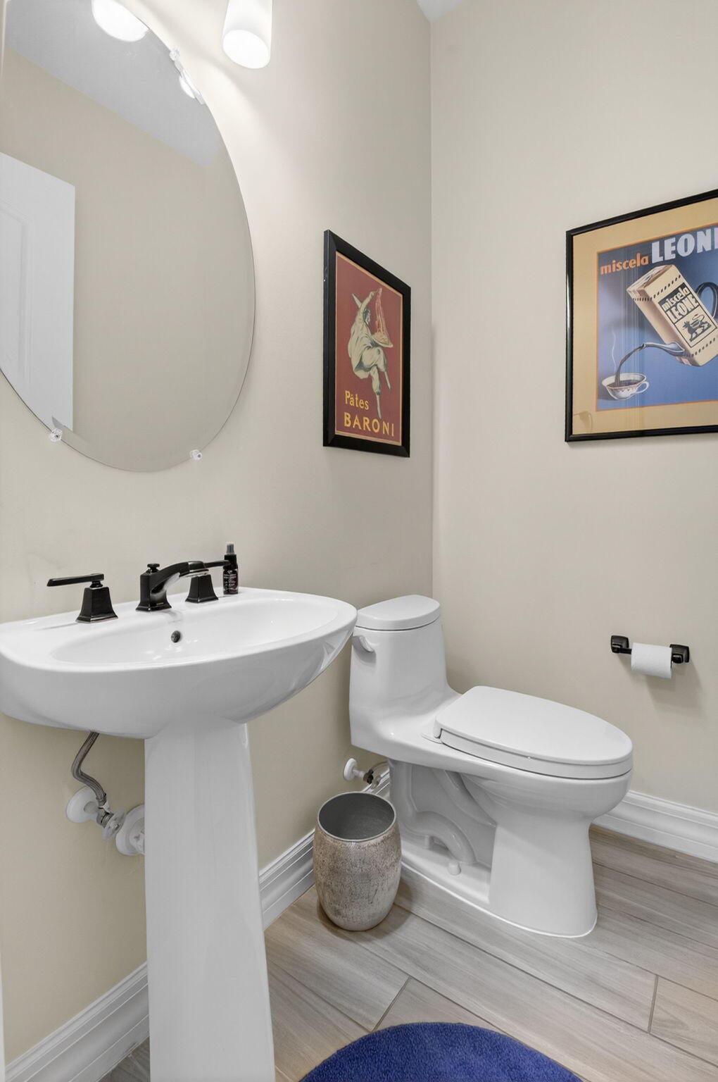 21956 Canadensis Circle, Unit 201 Boca Raton, FL 33428 - Photo 24 of 47 a bathroom with a sink toilet and a mirror