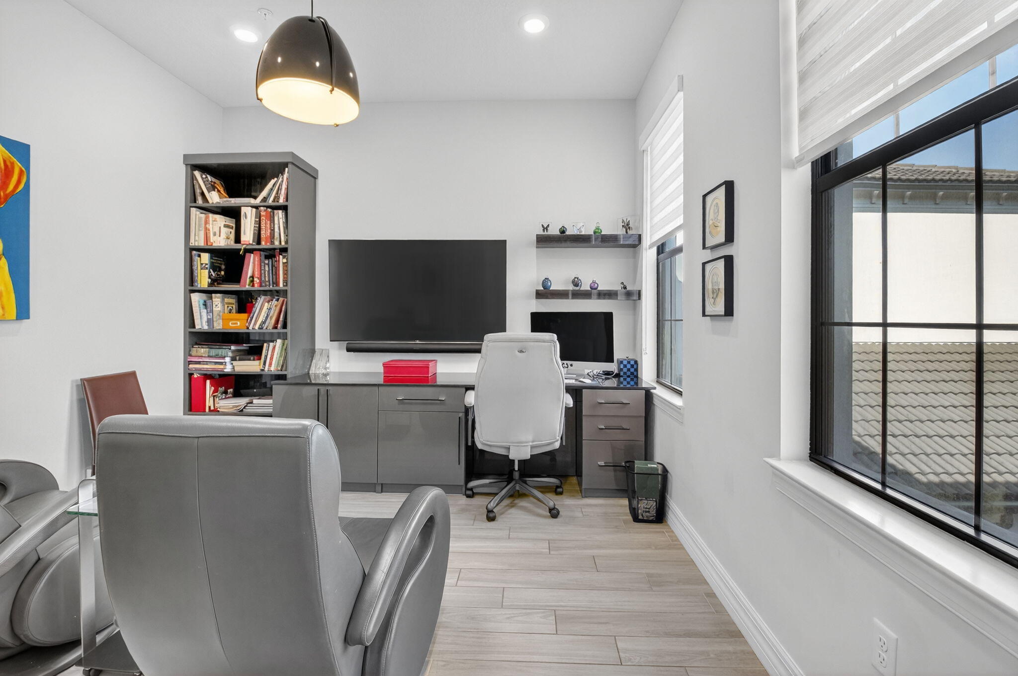 21956 Canadensis Circle, Unit 201 Boca Raton, FL 33428 - Photo 26 of 47 a living room with furniture and a flat screen tv
