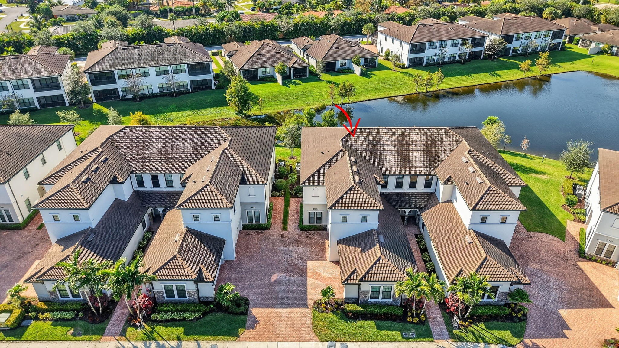21956 Canadensis Circle, Unit 201 Boca Raton, FL 33428 - Photo 42 of 47 an aerial view of a house with a garden and lake view