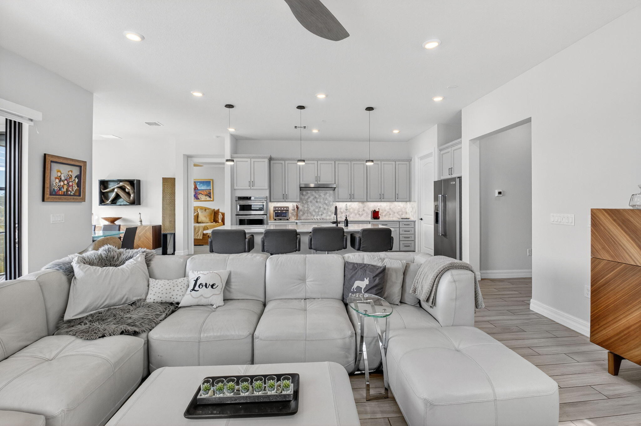 21956 Canadensis Circle, Unit 201 Boca Raton, FL 33428 - Photo 10 of 47 a living room with furniture and a large window