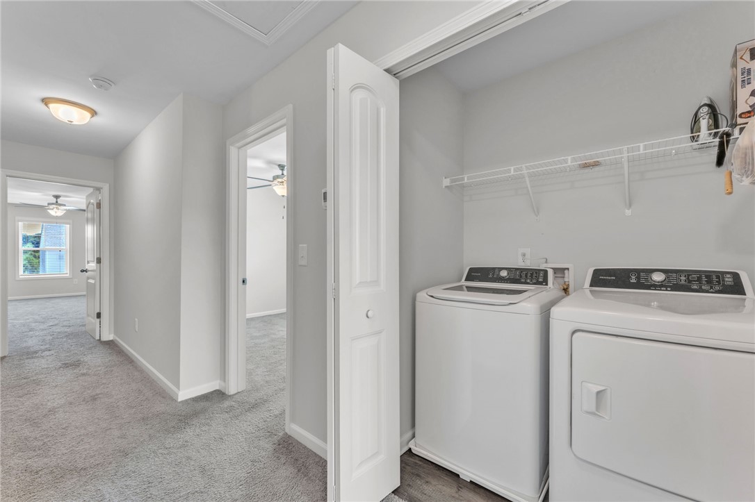 208 Samuel Street Pendleton, SC 29670 - Photo 23 of 32 Conveniently located laundry area, featuring modern appliances and a practical wire shelf for essentials.