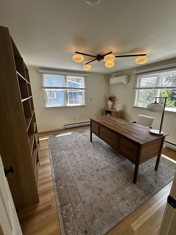 46 Sunset Road, Unit 46 Needham, MA 02494 - Photo 11 of 13 a living room with furniture and a flat screen tv
