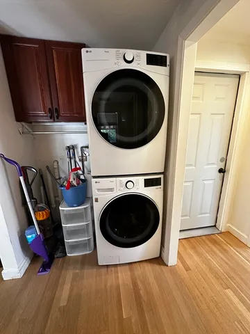 a view of a hallway with washer and dryer