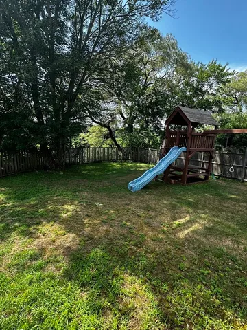 a view of a garden with a slide