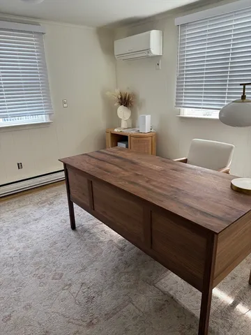 a view of a workspace with furniture