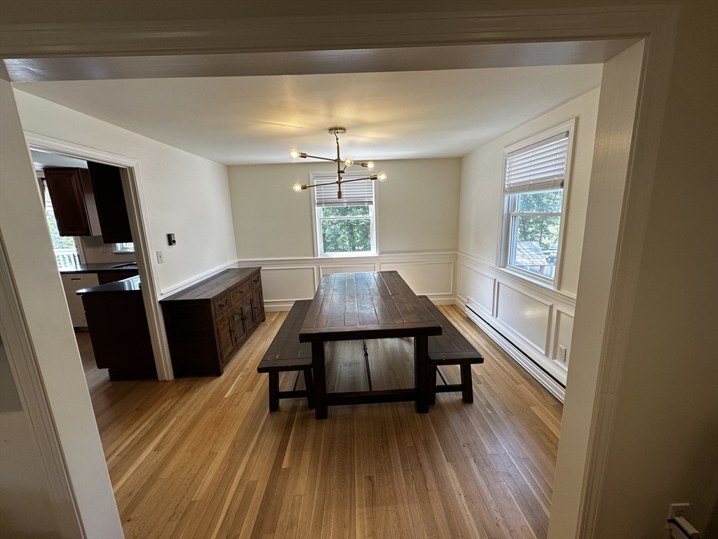 46 Sunset Road, Unit 46 Needham, MA 02494 - Photo 5 of 13 a view of a livingroom with furniture window and wooden floor