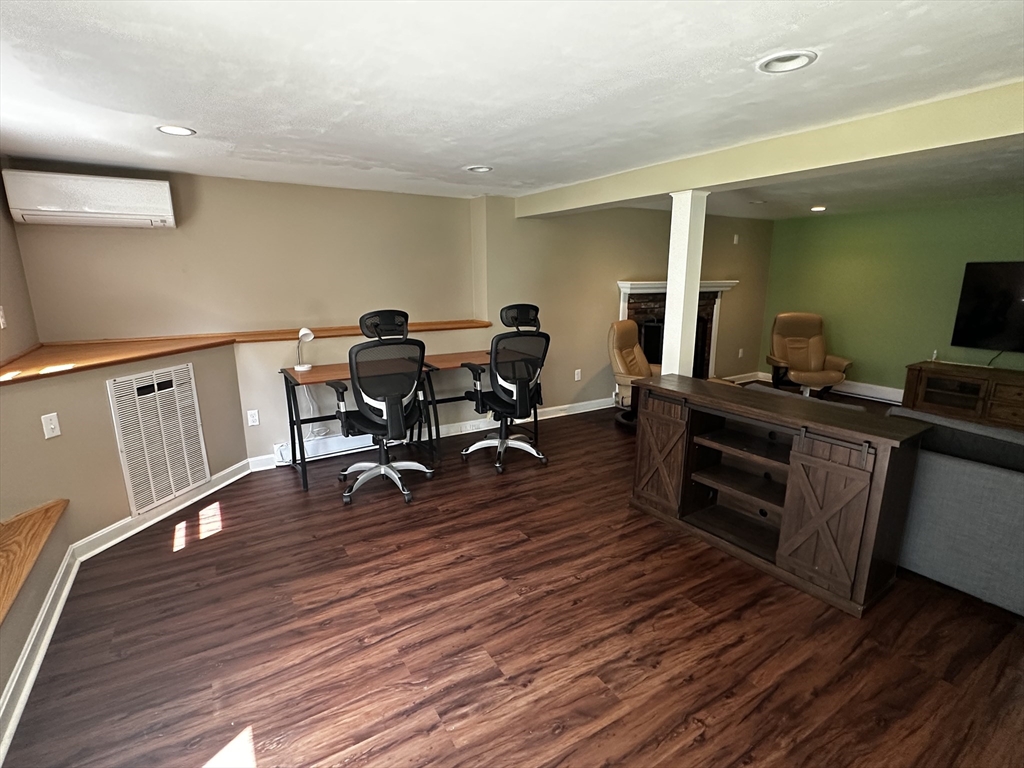 46 Sunset Road, Unit 46 Needham, MA 02494 - Photo 7 of 13 a view of a workspace with wooden floor