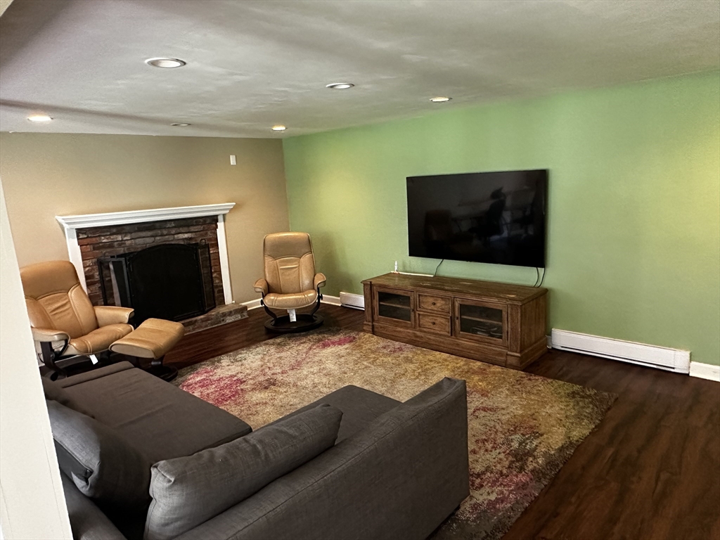 46 Sunset Road, Unit 46 Needham, MA 02494 - Photo 8 of 13 a living room with furniture and a flat screen tv