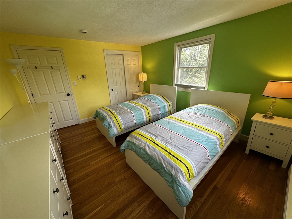 46 Sunset Road, Unit 46 Needham, MA 02494 - Photo 9 of 13 a bedroom with two beds and painted walls