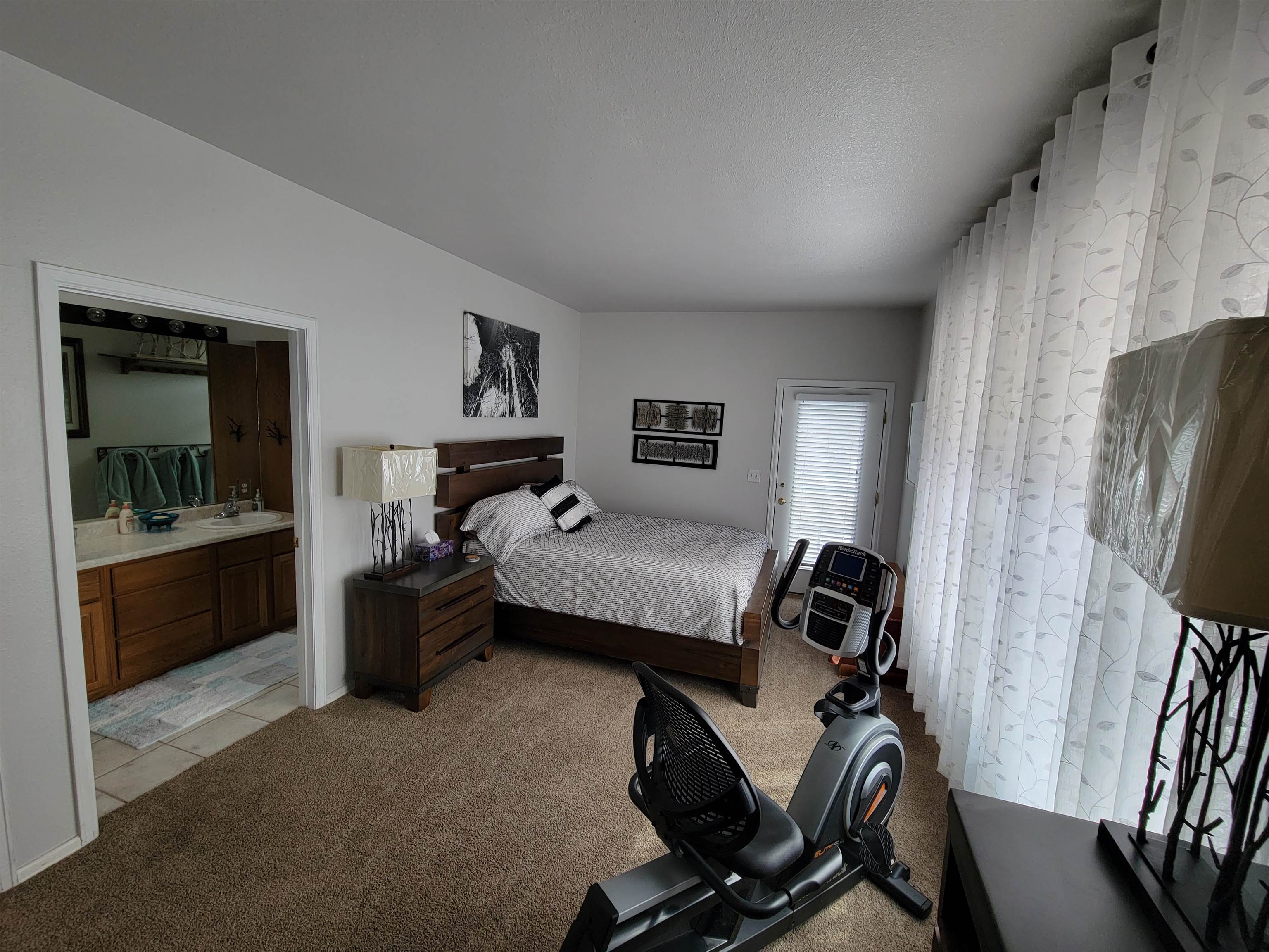 15753 Heavens View Road Cedaredge, CO 81413 - Photo 19 of 33 a bedroom with furniture and a window