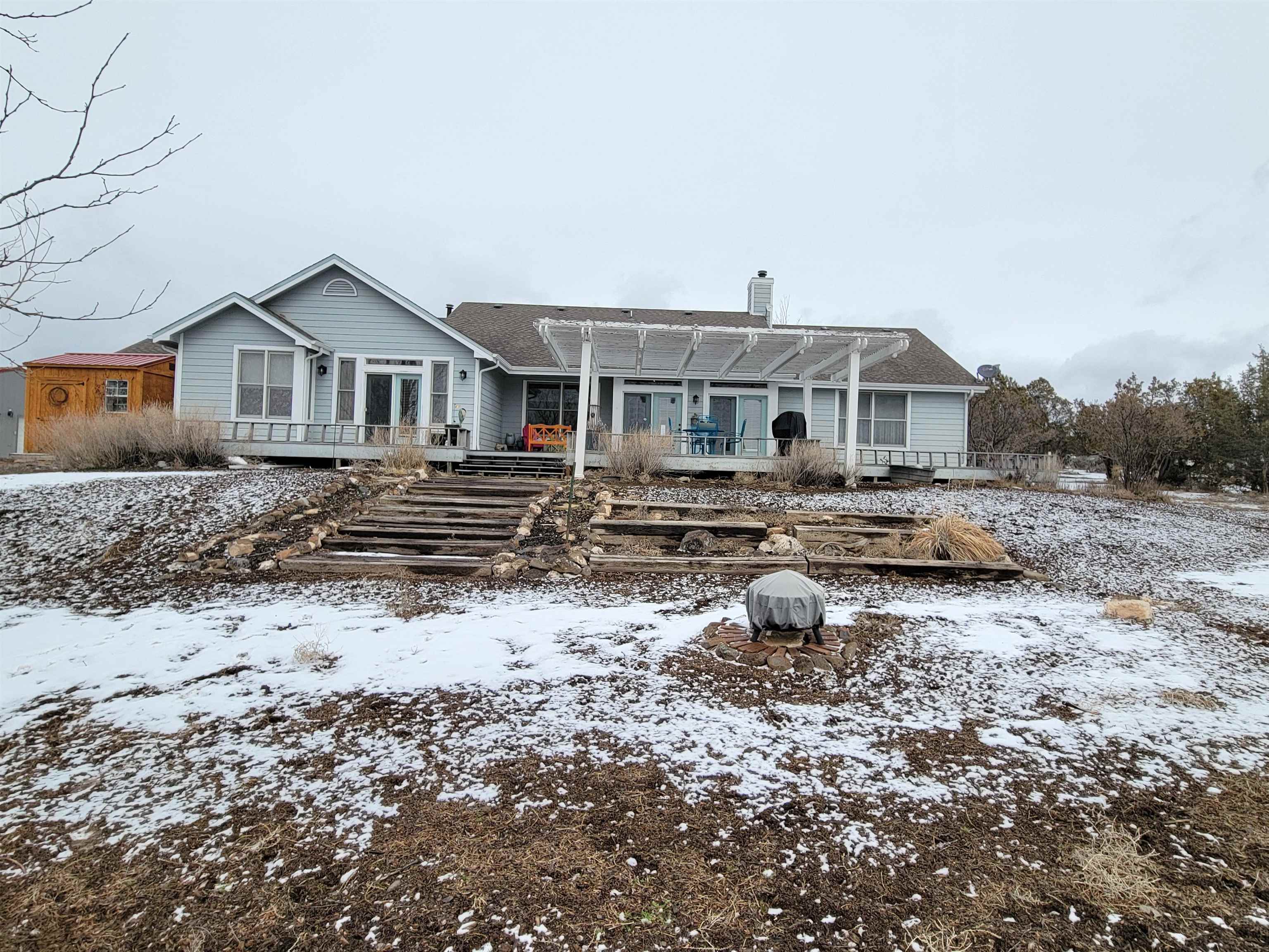15753 Heavens View Road Cedaredge, CO 81413 - Photo 28 of 33 a front view of a house with a yard