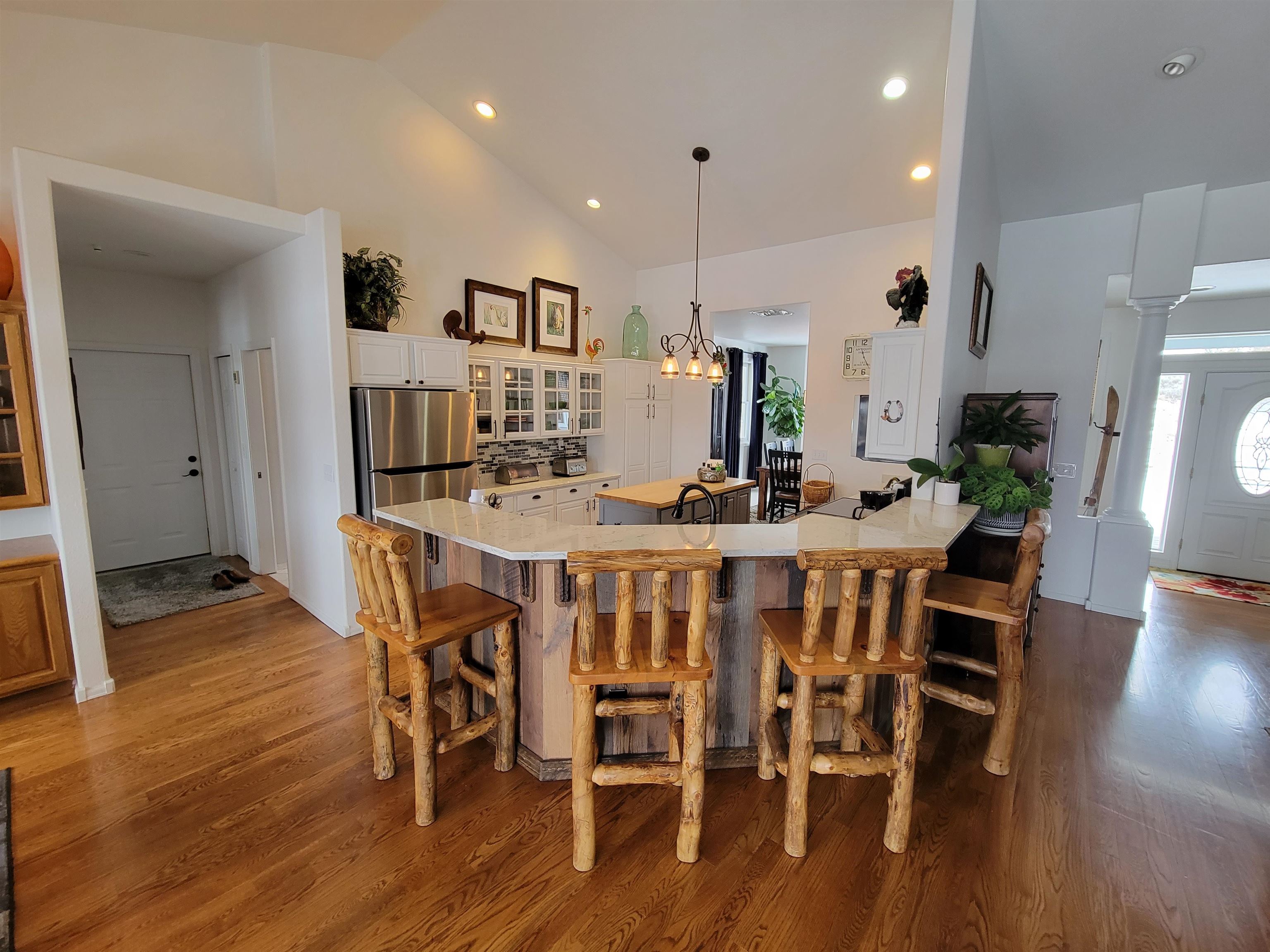 15753 Heavens View Road Cedaredge, CO 81413 - Photo 6 of 33 a view of a dining room with furniture and wooden floor