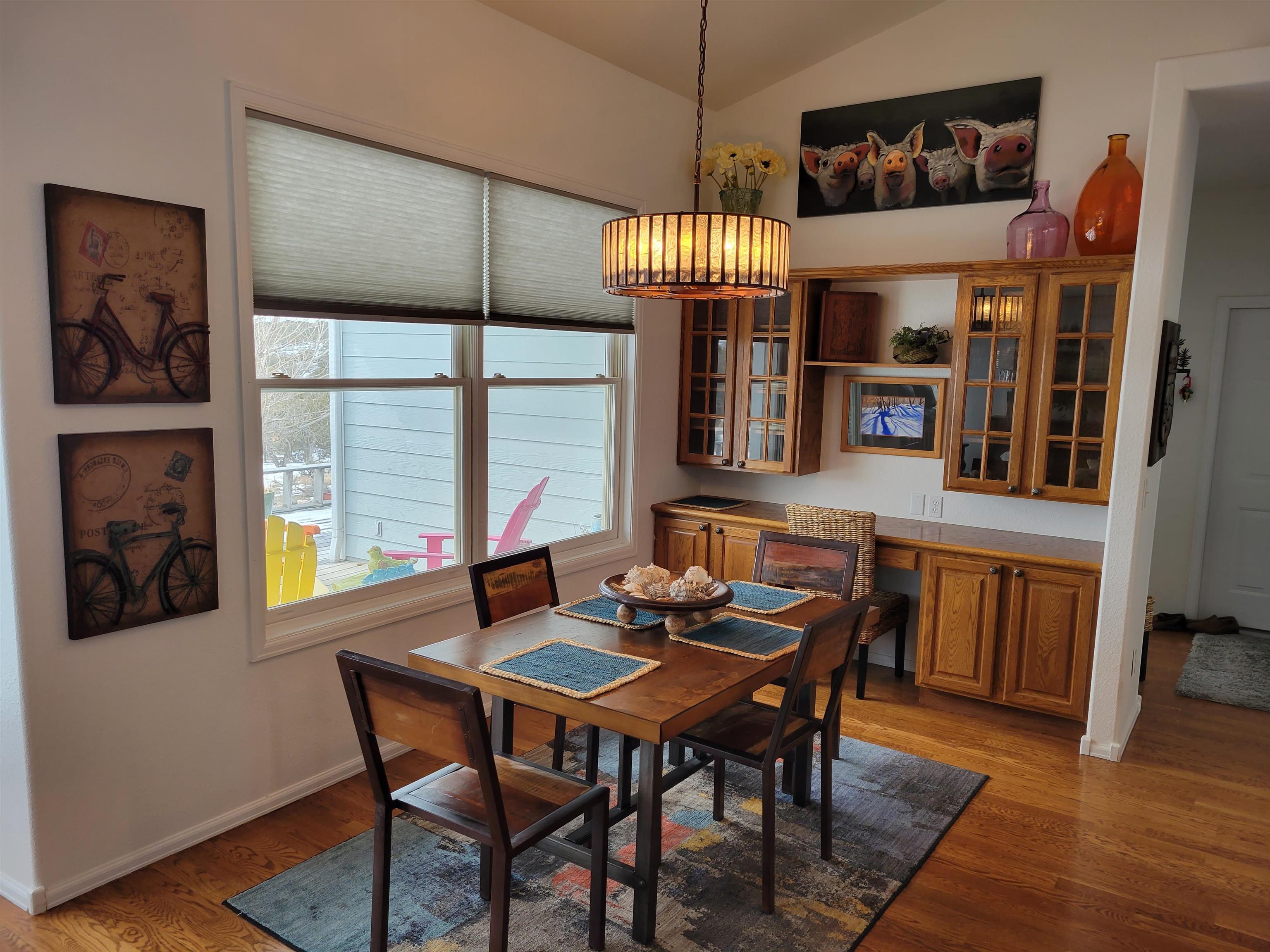 15753 Heavens View Road Cedaredge, CO 81413 - Photo 8 of 33 a view of a dining room with furniture wooden floor and chandelier