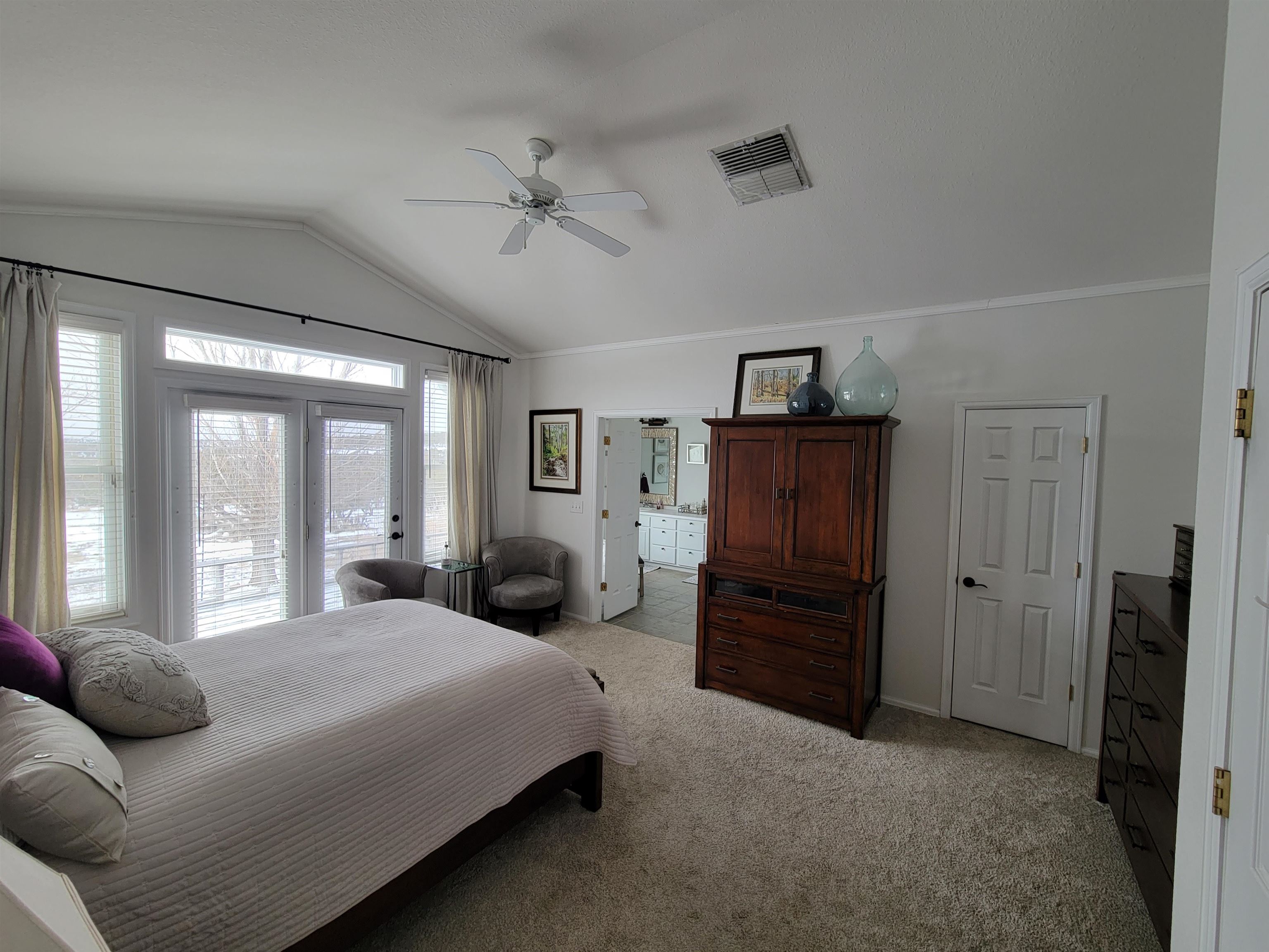 15753 Heavens View Road Cedaredge, CO 81413 - Photo 10 of 33 a bedroom with a bed and wooden floor