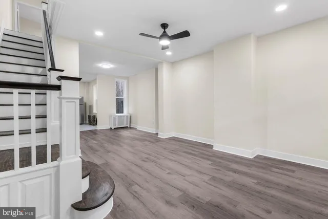 a view of a livingroom with furniture and wooden floor