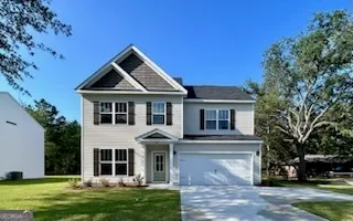 a front view of a house with a yard