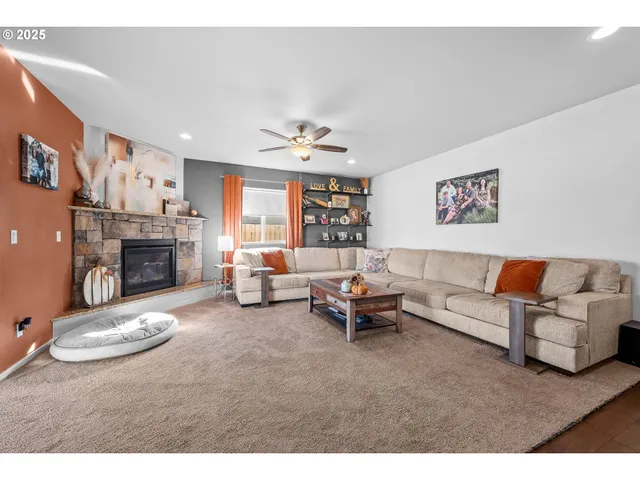 a living room with furniture and a fireplace