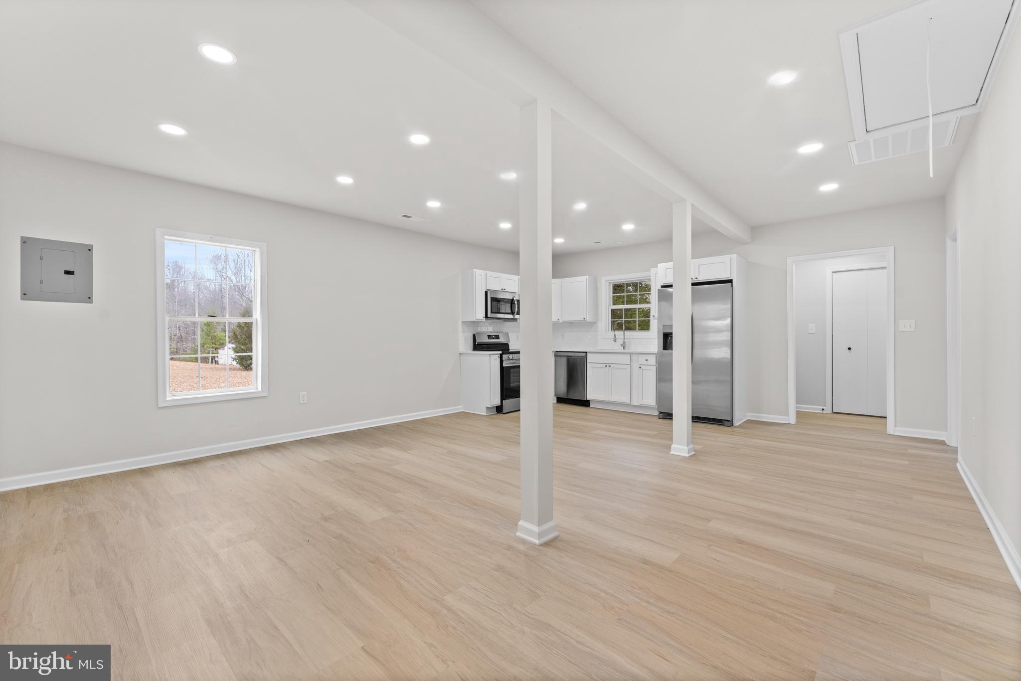 3578 Johnson Road Mineral, VA 23117 - Photo 11 of 27 an empty room with wooden floor and windows