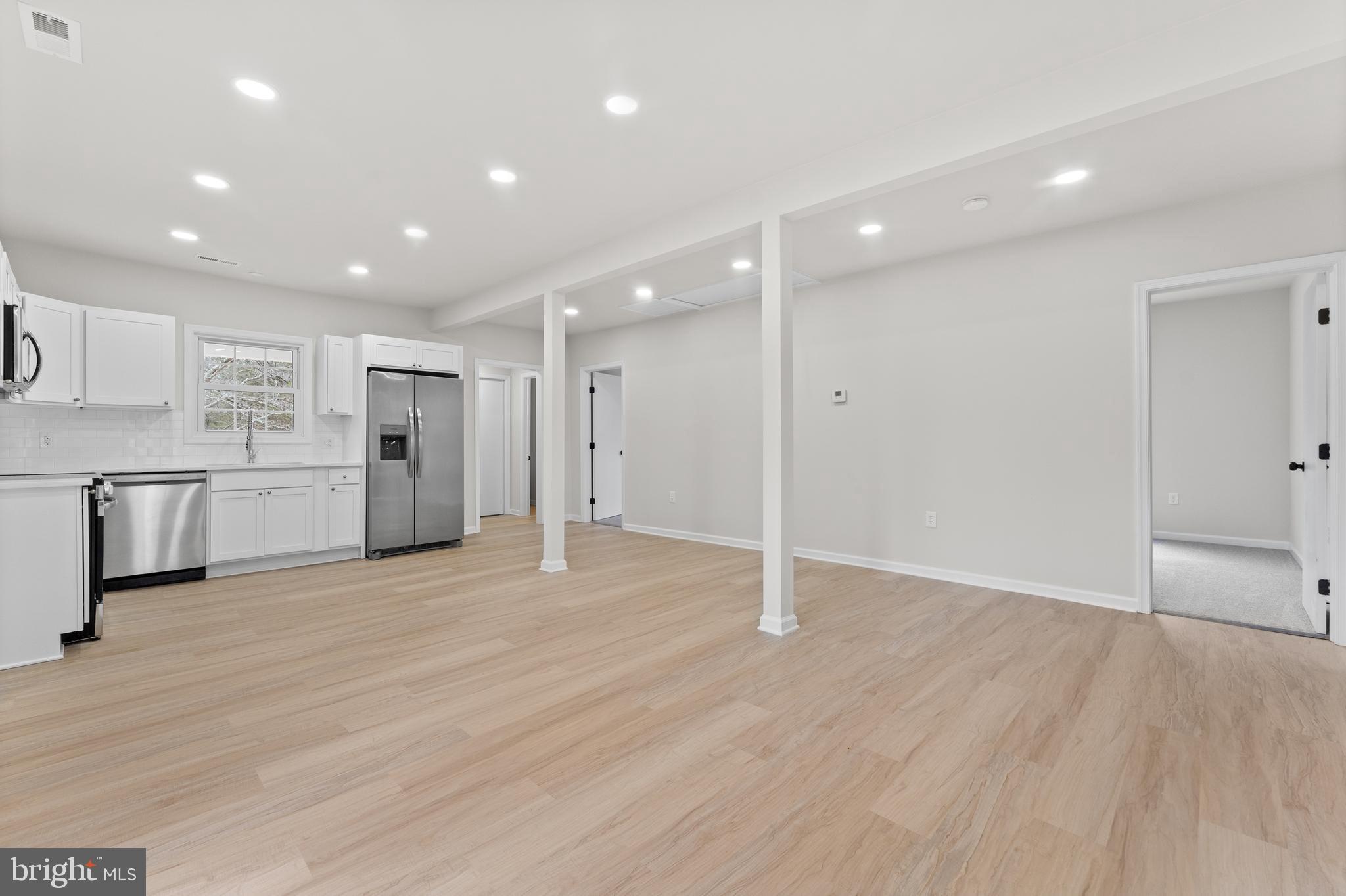 3578 Johnson Road Mineral, VA 23117 - Photo 12 of 27 an empty room with wooden floor and windows