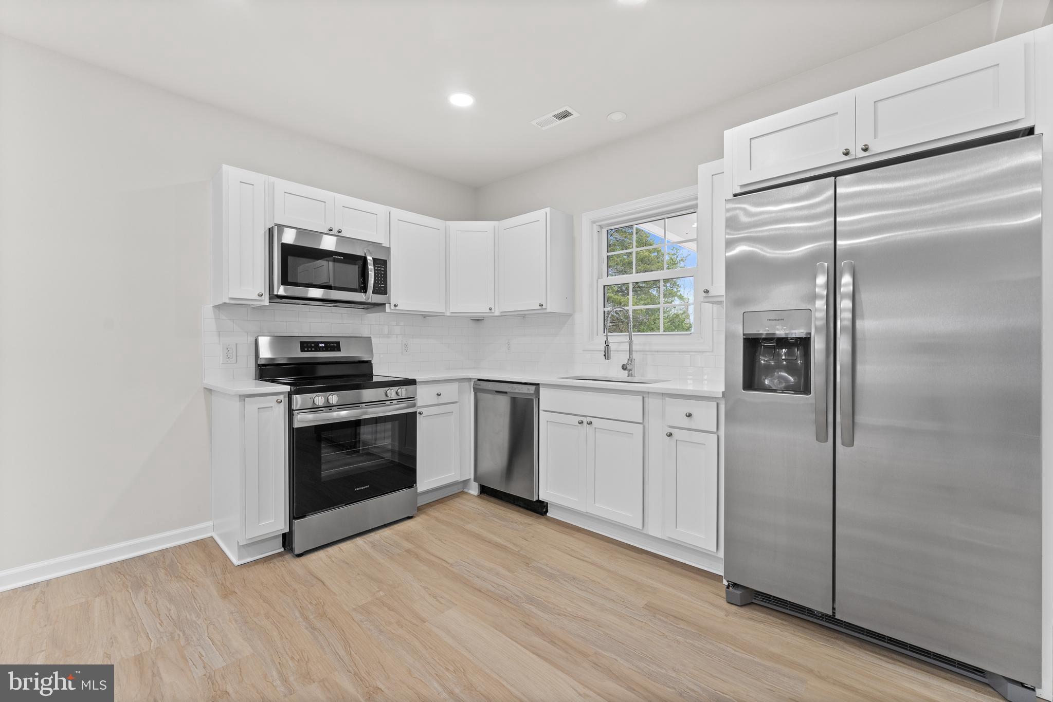 3578 Johnson Road Mineral, VA 23117 - Photo 15 of 27 a kitchen with a refrigerator stove and a sink