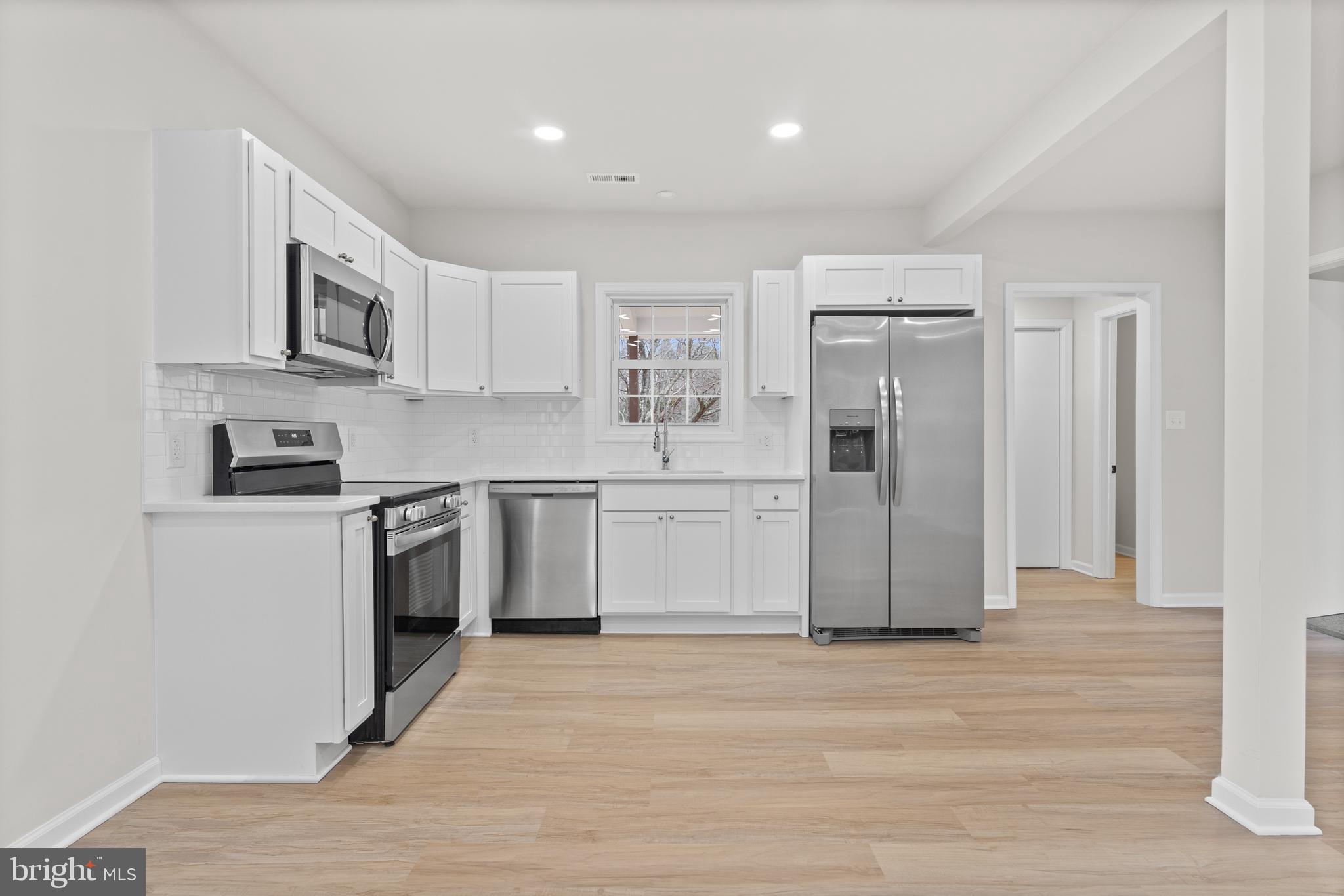 3578 Johnson Road Mineral, VA 23117 - Photo 16 of 27 a kitchen with stainless steel appliances a refrigerator stove and sink