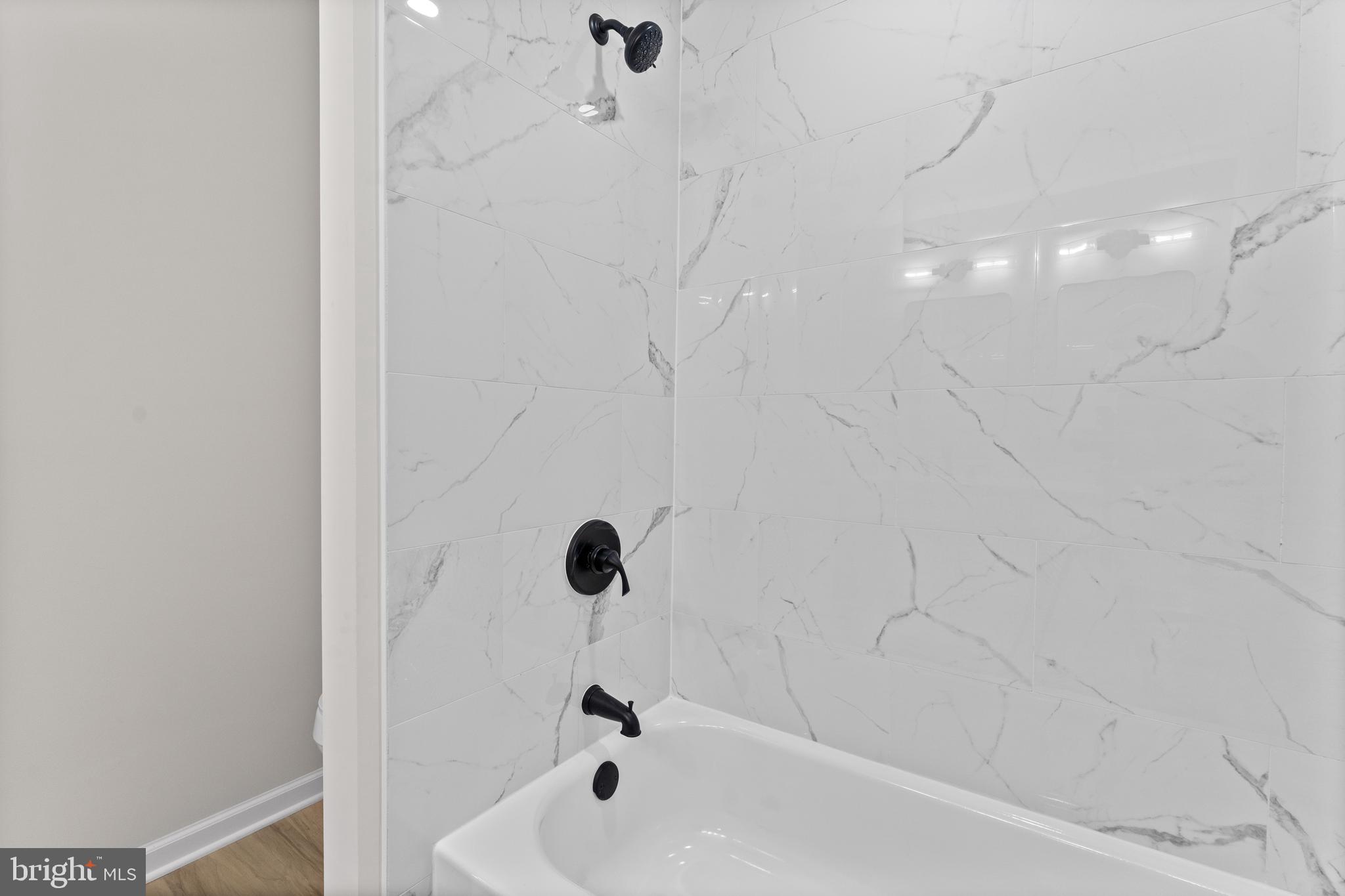 3578 Johnson Road Mineral, VA 23117 - Photo 22 of 27 a bathroom with a bathtub and shower