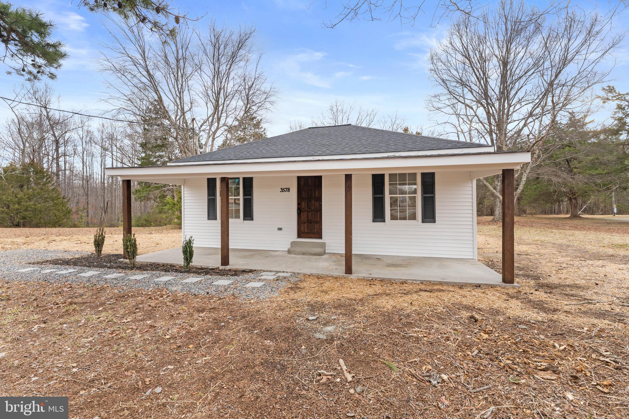 3578 Johnson Road Mineral, VA 23117 - Photo 4 of 27 a white house that has a tree in front of it