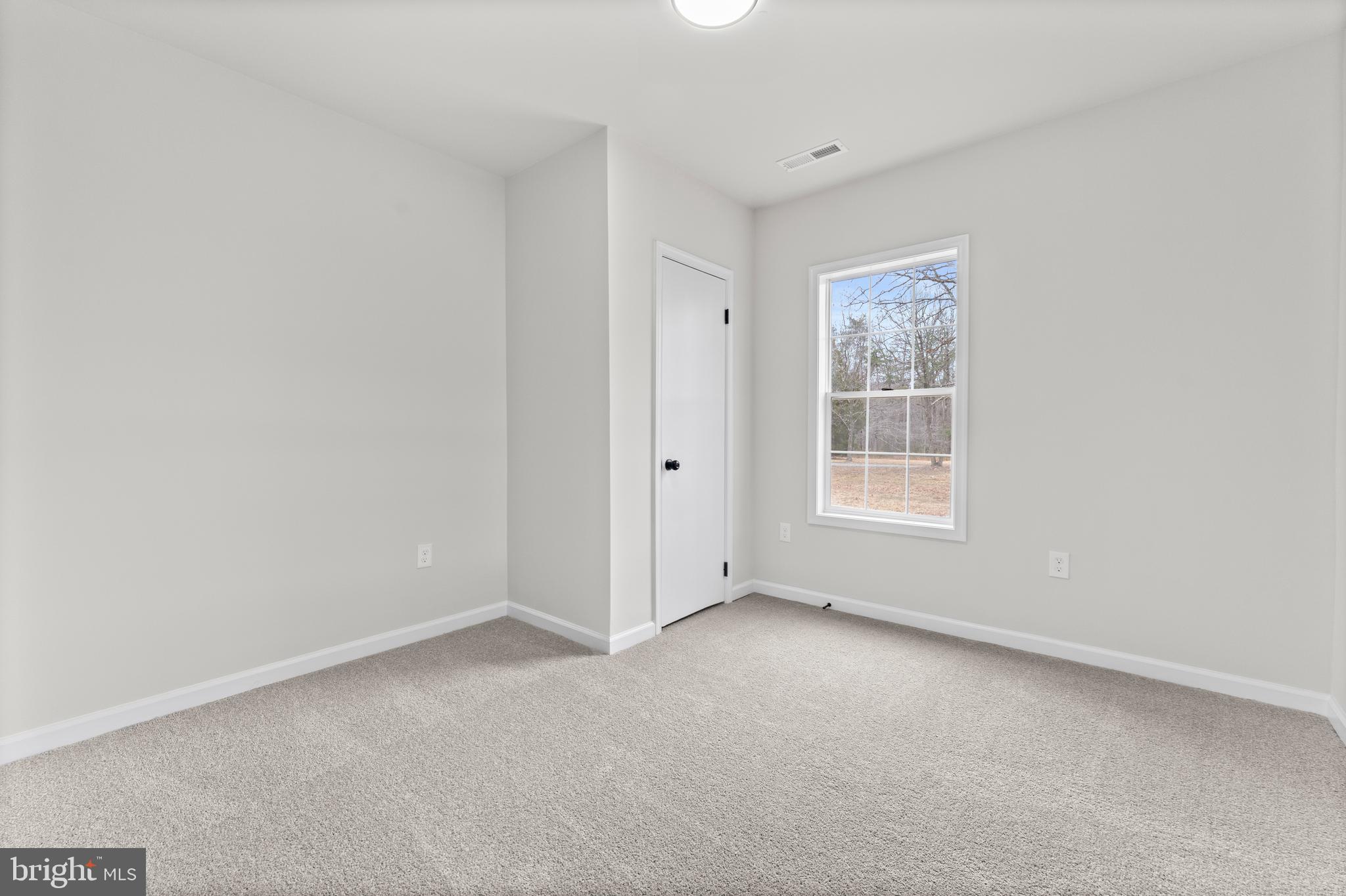 3578 Johnson Road Mineral, VA 23117 - Photo 9 of 27 an empty room with windows