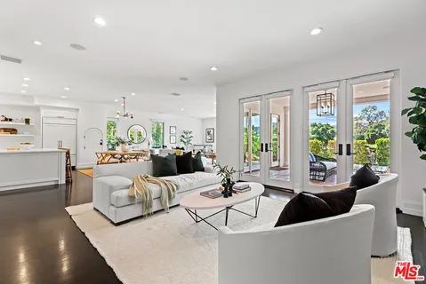 a view of an outdoor sitting area with furniture and garden view