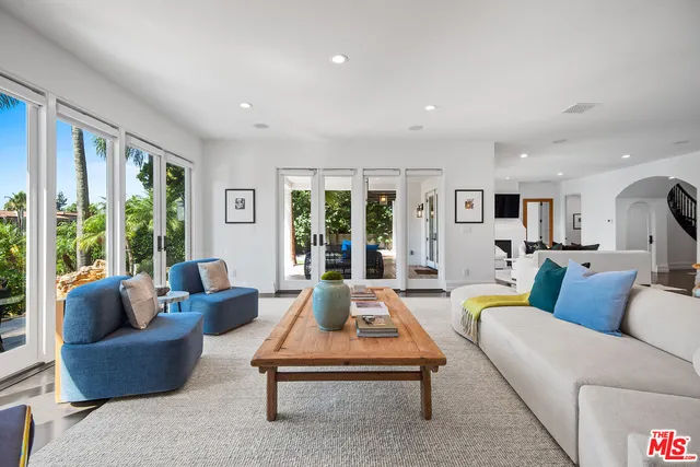 a bathroom with a sink tub and a mirror