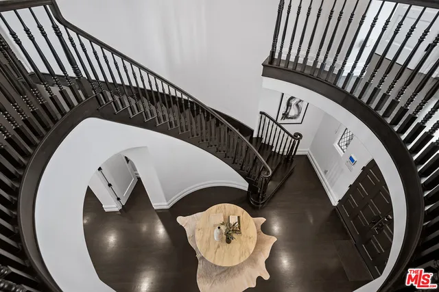 a spacious bedroom with a large bed and a large window